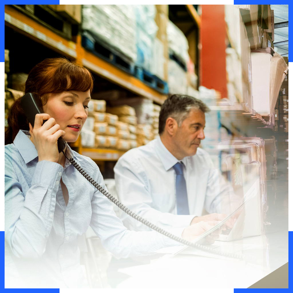 People at the desk in warehouse